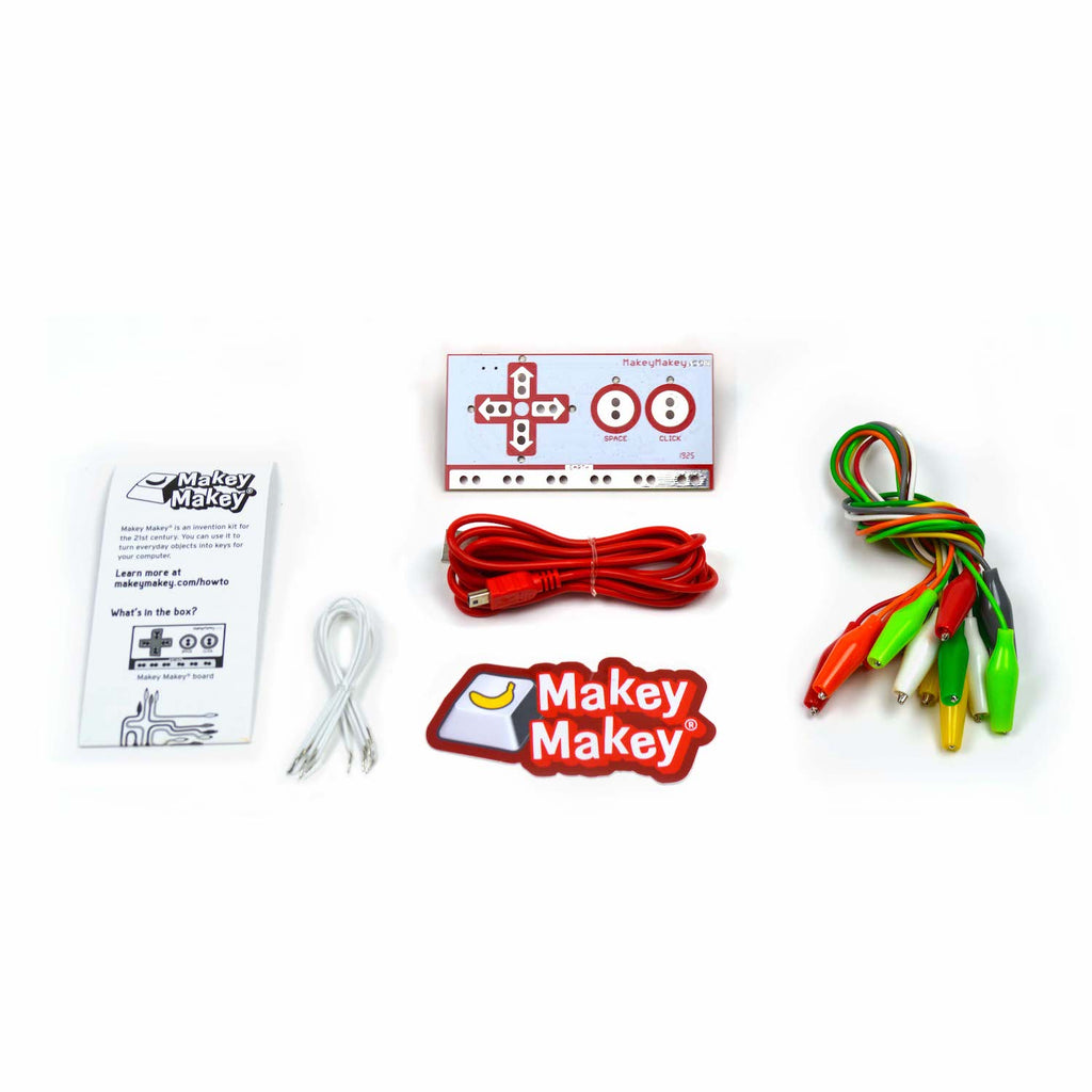 Makey Makey Circuit Board, USB cable, Instruction booklet, white jumper wires, Makey Makey sticker, and 7 alligator clips